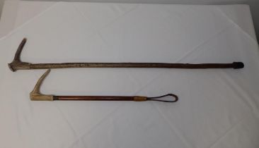 A horn-handled riding crop and walking stick. (2)