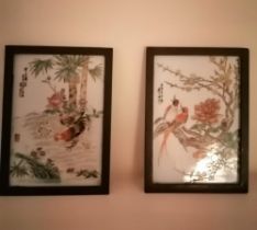 A pair of signed Chinese polychrome painted porcelain plaques, one depicting a cockerel with hen and