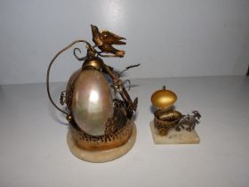 A 'Palais Royal' table bell with bird finial, 5.5" high and a goat & cart thimble holder. (2)