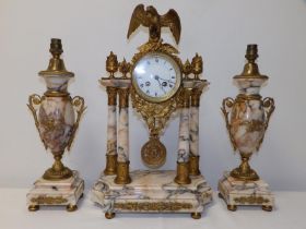 A late 19thC French pale marbled & gilt metal mounted three piece clock garniture, the clock