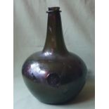 A very large onion shaped 17thC glass bottle with heraldic seal, circa 1690 - the section around the