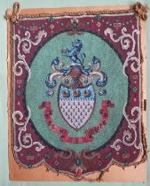 A large beadwork panel depicting a coat of arms - 'RE E MERITO' - Hebdon/Ebdon family, 22.5" x 17.