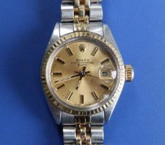 A lady's stainless steel and gold Rolex Oyster Perpetual Date bracelet wrist watch with gold dial,