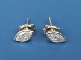 A pair of marquise cut diamond stud earrings, the collet set stones of total weight approximately