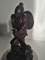 A Chinese carved wood figure of a fisherman on marble stand, 9" high.