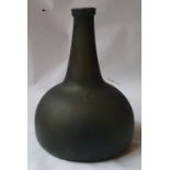 An antique onion shaped glass bottle , 7.75" high.