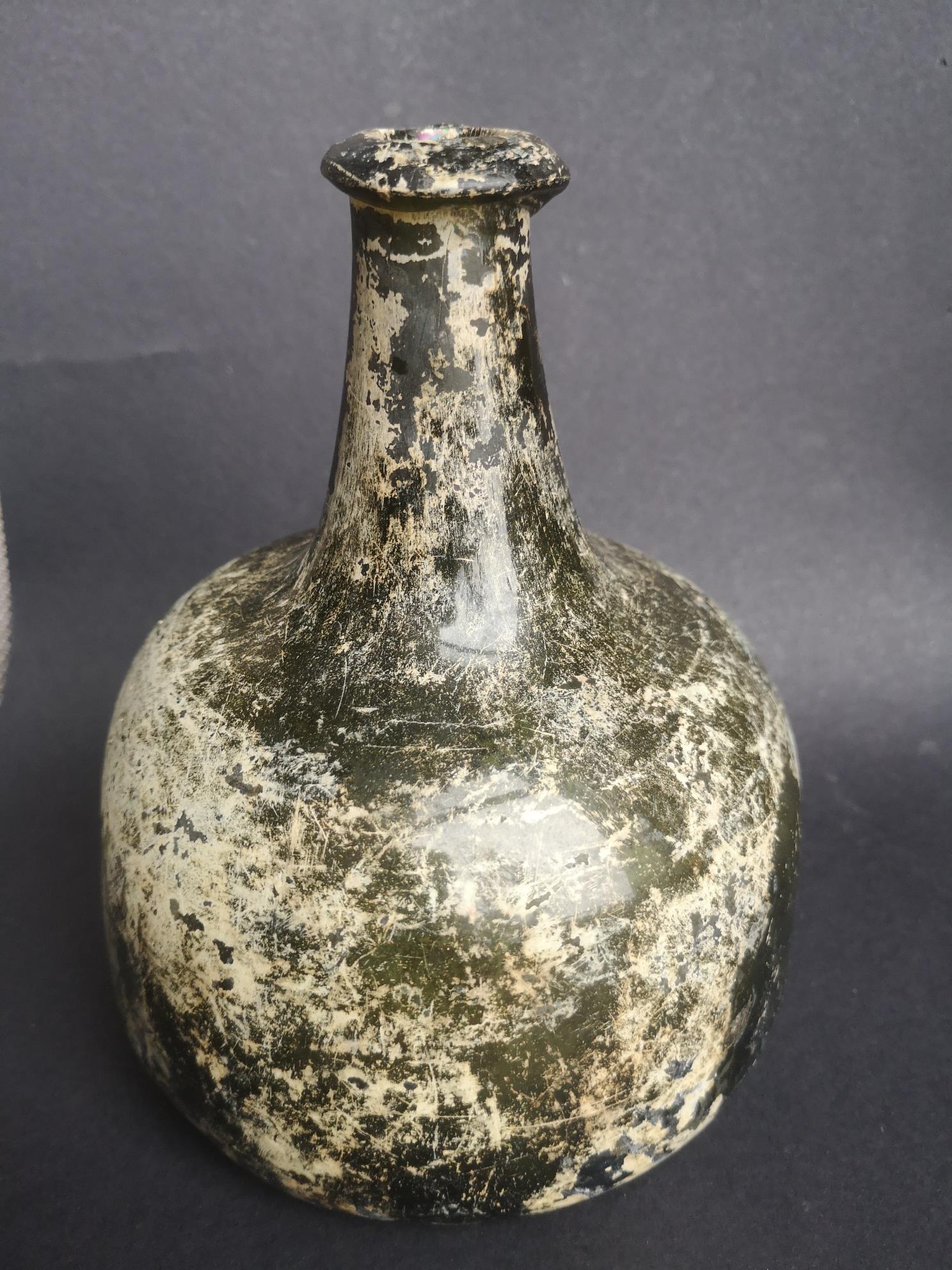 An antique onion shaped glass wine bottle, 6.4" high - crack to side. - Image 2 of 5