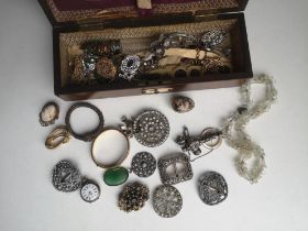 Walnut domed box & contents silver baby's rattle, diamond paste & other costume jewellery.