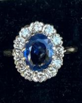 A certified natural 2.68 Sri-Lankan sapphire & diamond oval cluster ring, on 18ct gold shank,