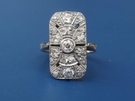 An art deco diamond millegrain set 18ct white gold panel ring of open rectangular form. Finger