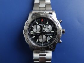 A boxed gent's stainless steel Breitling Colt Chronograph II bracelet wrist watch, the black dial