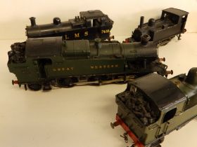 A Great Western O gauge electric locomotive 2-6-2 and three tank locos. (4)