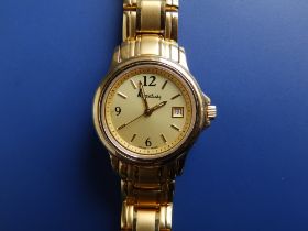 A lady's gold plated Kutchinsky quartz bracelet wrist watch, case diameter 27mm - unused.