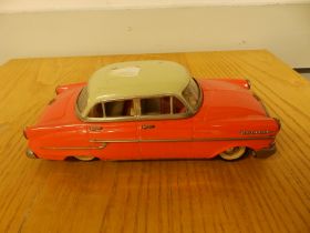 An Opel Kapitan tinplate model car, 9.5" long.