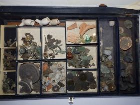 A case containing a variety of excavated 'finds'.