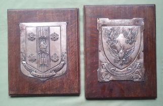 Two large silver plated metal shields mounted on wood panels - Queen's College, Oxford & Rossall