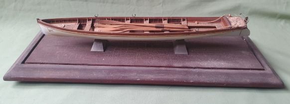 A scratch built model of an early lifeboat, the boat length 16".