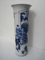 A Chinese blue & white porcelain cylinder vase, depicting a dignitary seated before a window, with