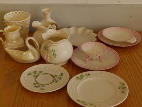 Seven pieces of Belleek porcelain with black factory marks, four pieces with brown marks and two