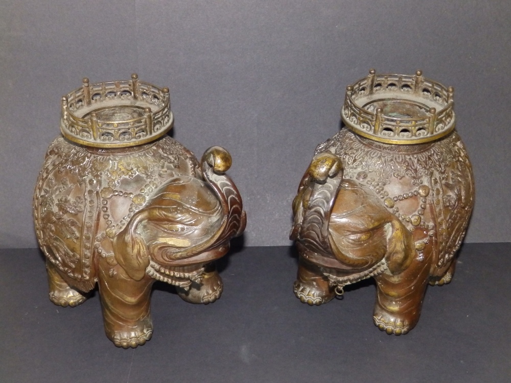 A pair of Chinese bronze elephant incense burners, 10.5" across. (2)