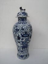 A Chinese blue & white porcelain meiping covered vase, having overall decoration depicting two men