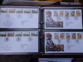 Four albums first day covers, two loose leaf world stamp albums and a quantity of loose stamps.