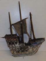 A small wooden model galleon, 16.5" overall length.