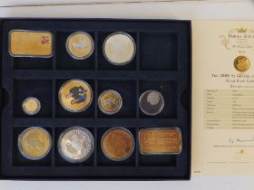 A 2009 St George and Dragon 9ct gold half crown and ten other coins/medals. (11)