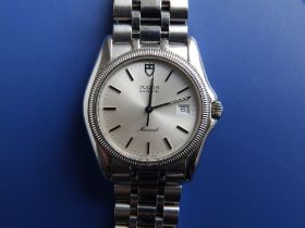 A boxed gent's stainless steel Tudor quartz Monarch bracelet wrist watch, with date indicator,
