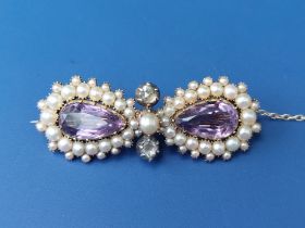 A pearl, rose cut diamond and amethyst brooch of figure-of-eight form, 1.75" across.