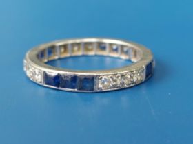 A diamond & calibre set sapphire platinum eternity ring. Finger size M/N.
