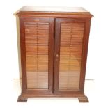 A Victorian mahogany slide cabinet, previously at Allhallows College, Rousden, the 30 drawers