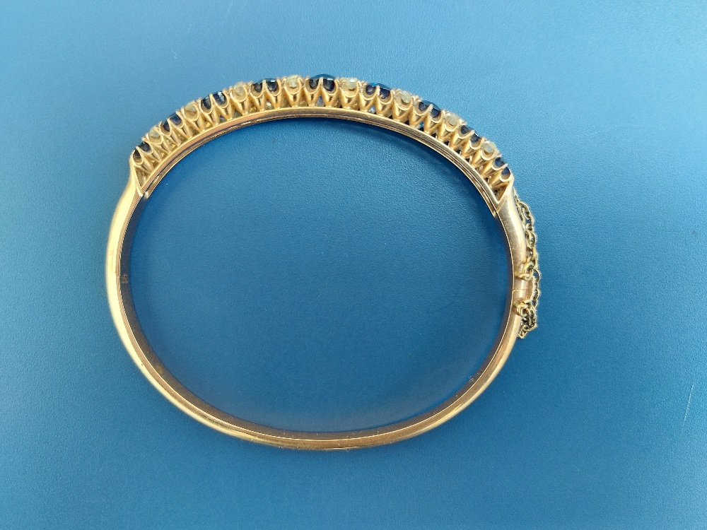 A Victorian sapphire & diamond claw set gold bangle, having nine graduated cushion cut sapphires and - Image 6 of 6