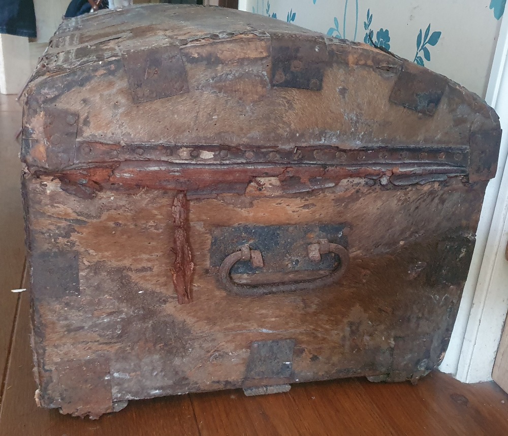 A large hide-covered trunk having studded decoration, original paper label, 33" across. - Image 4 of 5