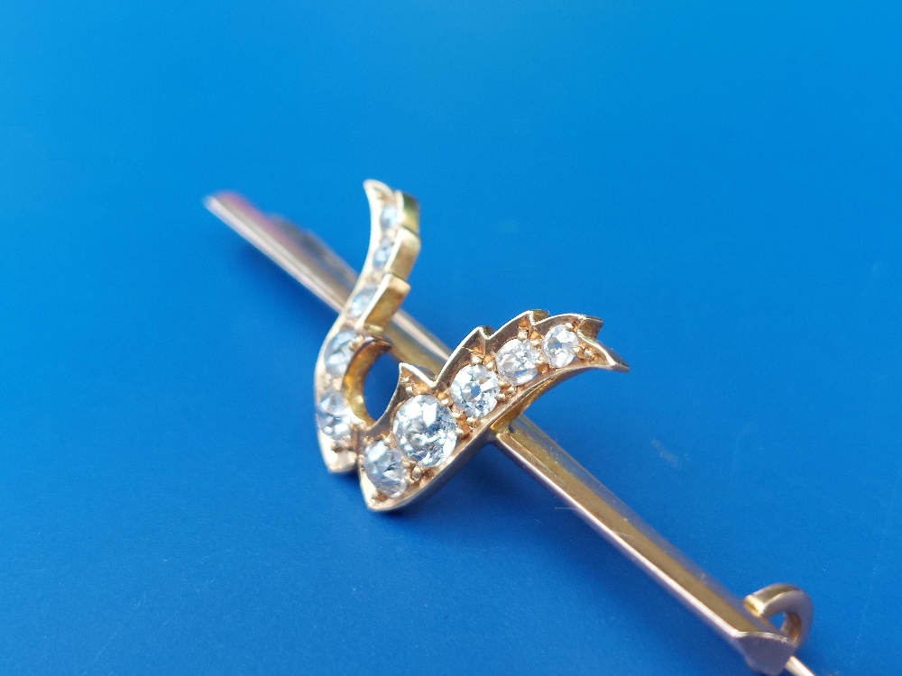 A late Victorian diamond set yellow metal bar brooch, the stones set as a stylised tulip head, 2". - Image 3 of 3