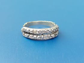 A 19thC twin-row diamond set half eternity ring. Finger size O/P.