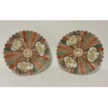 A pair of Japanese porcelain chargers with panelled decoration, scalloped rims, 12" diameter (2)