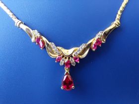A modern ruby & diamond set '14k' pendant necklace, the pendant 1.75" across.