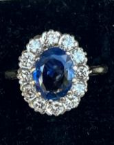 A certified natural 2.68 carat Sri-Lankan sapphire & diamond oval cluster ring, on 18ct gold