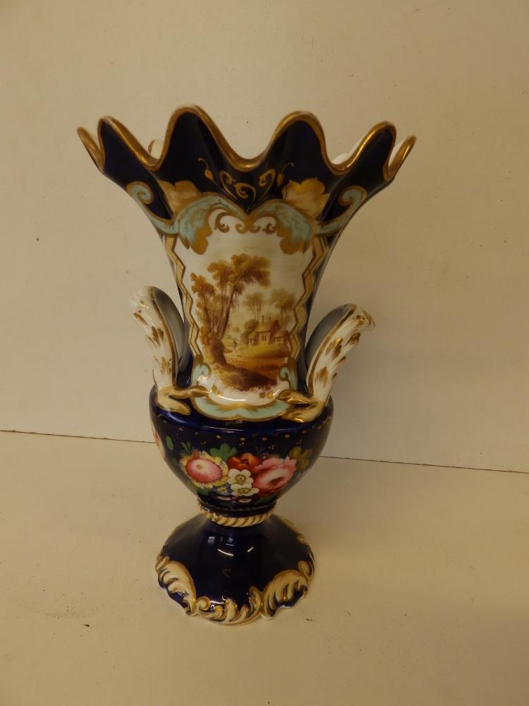 A Victorian porcelain vase painted with landscape and flowers - '221', 9" high.