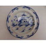 A blue & white chinoiserie plate, decorated with a pagoda in landscape, 8.4" diameter.