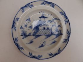 A blue & white chinoiserie plate, decorated with a pagoda in landscape, 8.4" diameter.