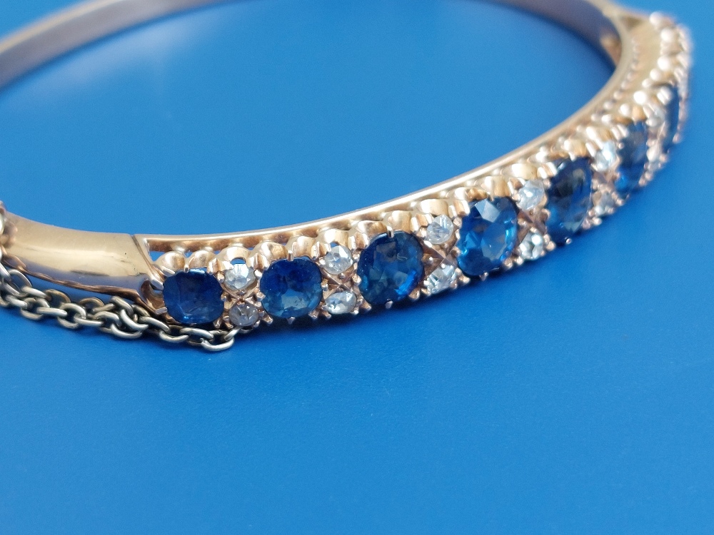 A Victorian sapphire & diamond claw set gold bangle, having nine graduated cushion cut sapphires and - Image 2 of 6