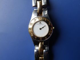 A ladies gold plated and stainless steel Baume & Mercier bracelet wrist watch, with white dial,
