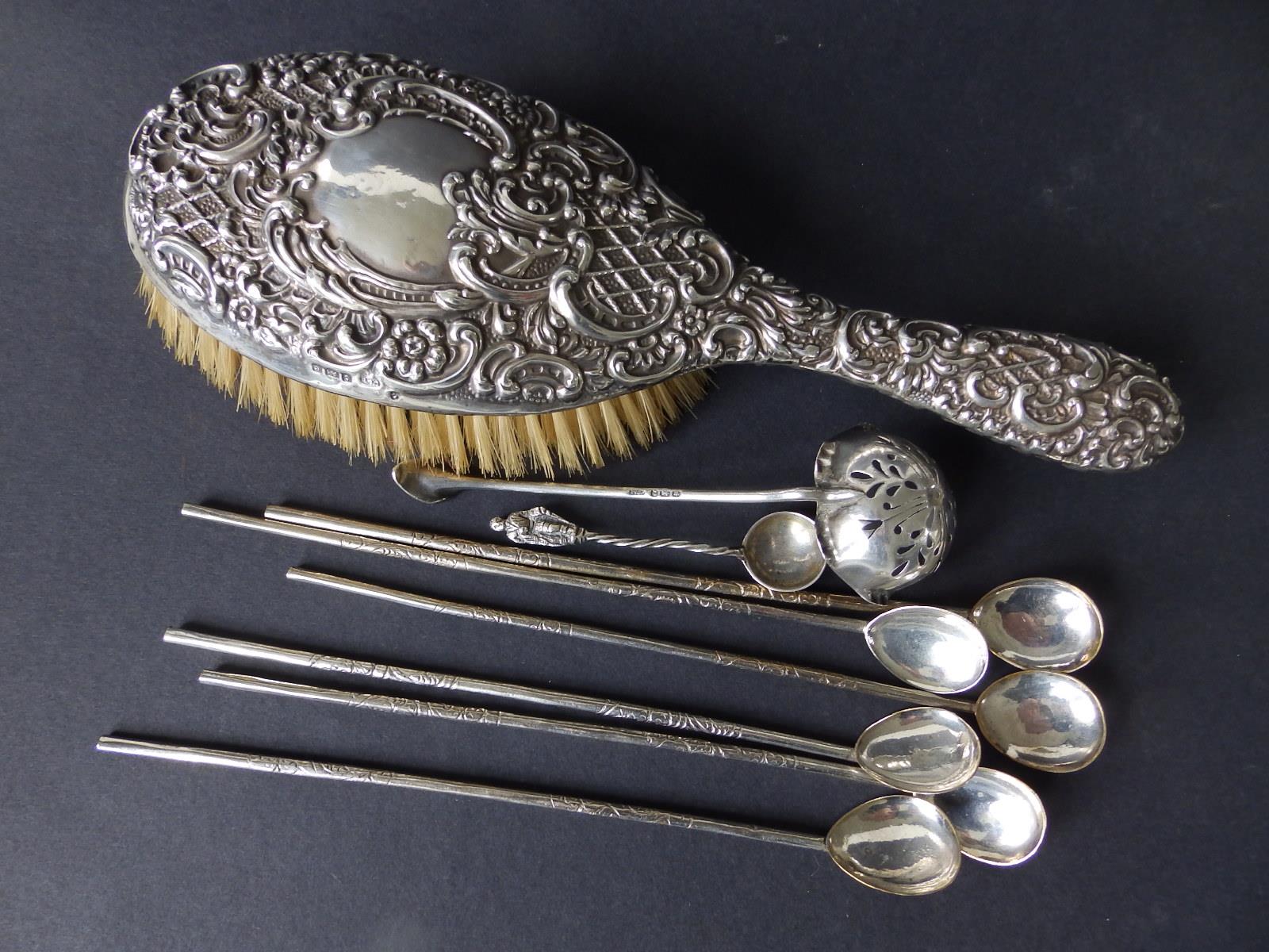 A Birmingham silver embossed hair brush, a Dixon & Sons silver sugar sifter and seven other
