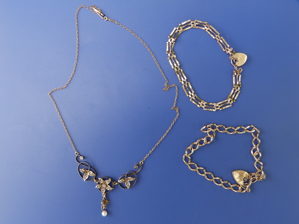 A pearl set '10k' necklace and two 9ct gold bracelets. (3)