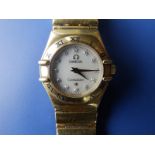 A ladies 18ct gold Omega Constellation bracelet wrist watch with diamond dot numerals to the