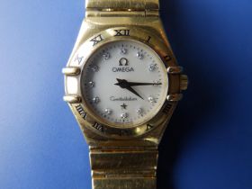A ladies 18ct gold Omega Constellation bracelet wrist watch with diamond dot numerals to the