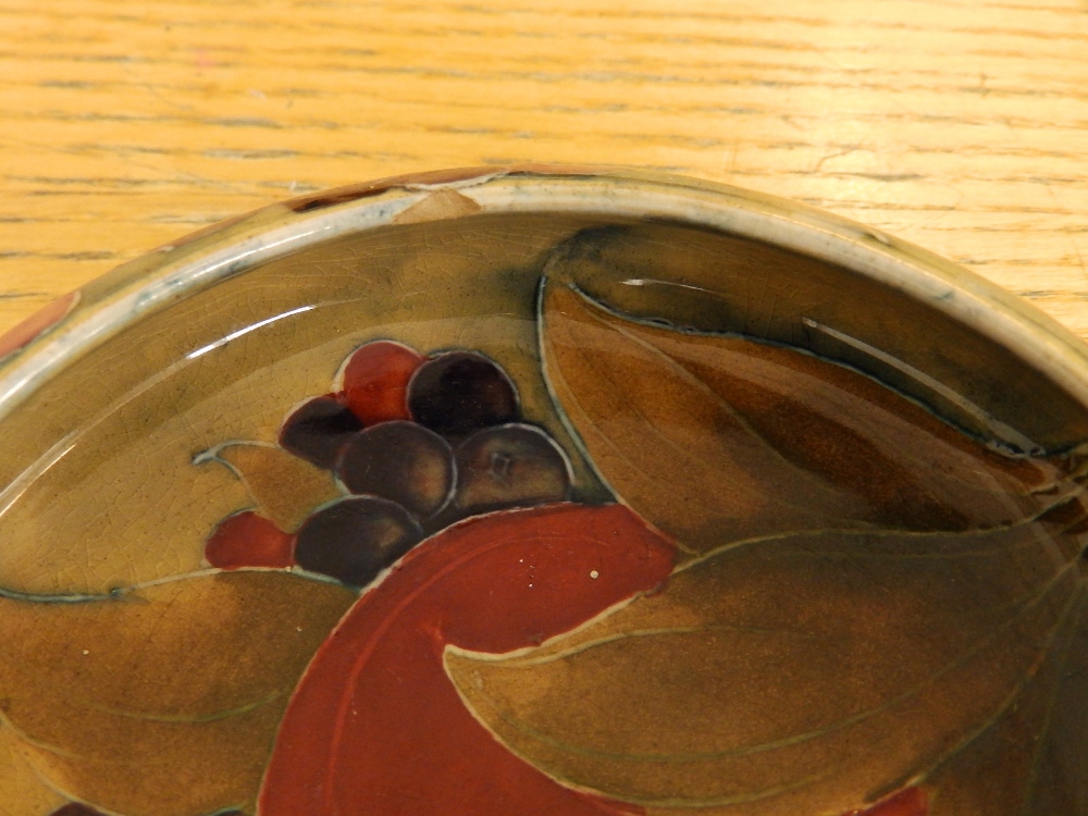 A small Moorcroft Pomegranate pattern bowl, 4.2" diameter - a/f, a covered Moorcroft jar, 5.5" - Image 5 of 5