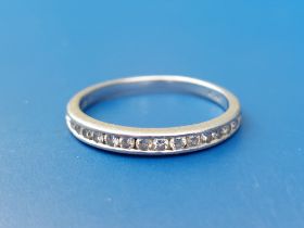 A diamond set platinum half eternity ring - total diamond weight 0.25 carat. Finger size M.